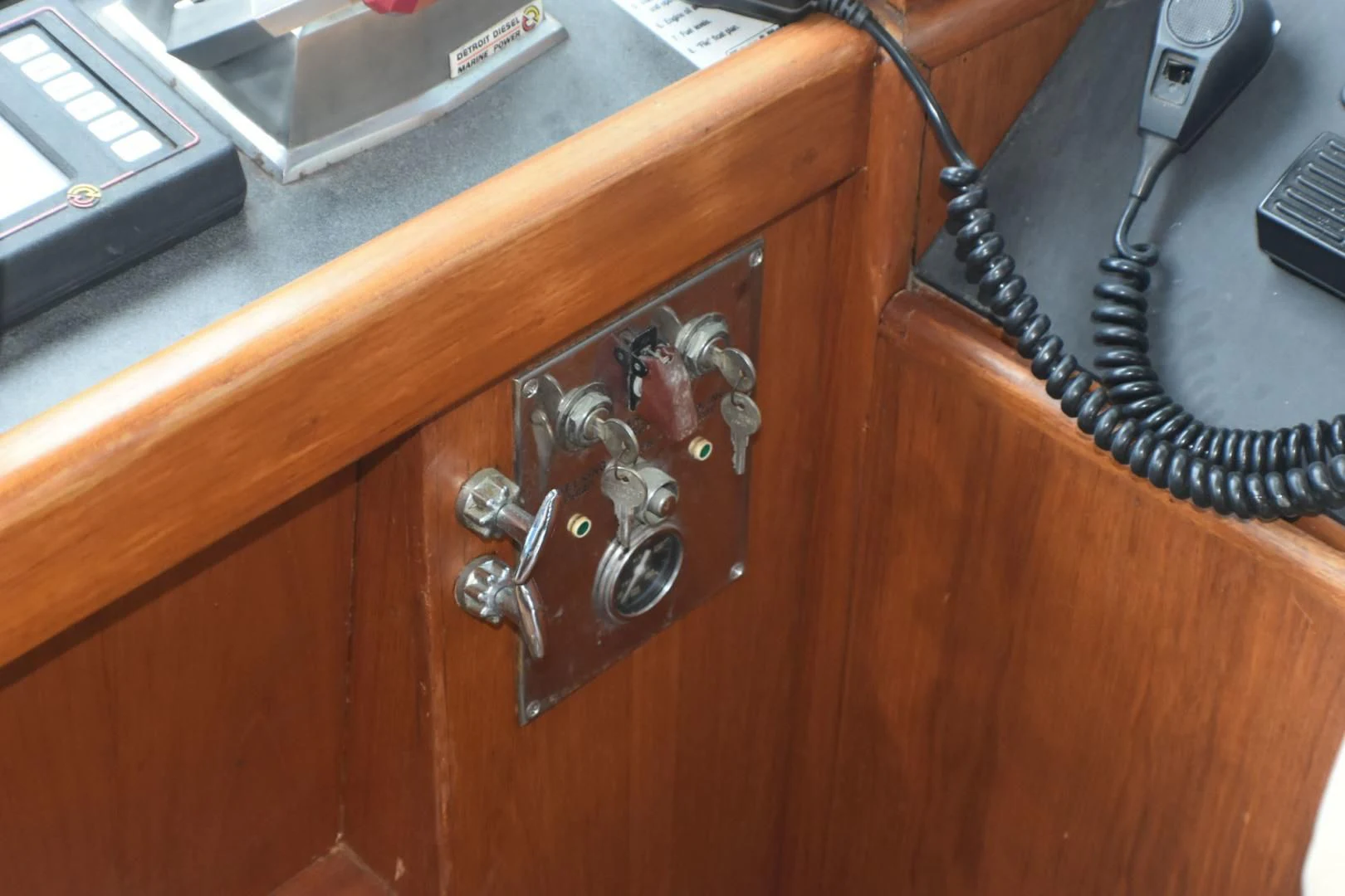 a wooden cabinet with a key chain aboard JEWEL OF THE NILE Yacht for Sale