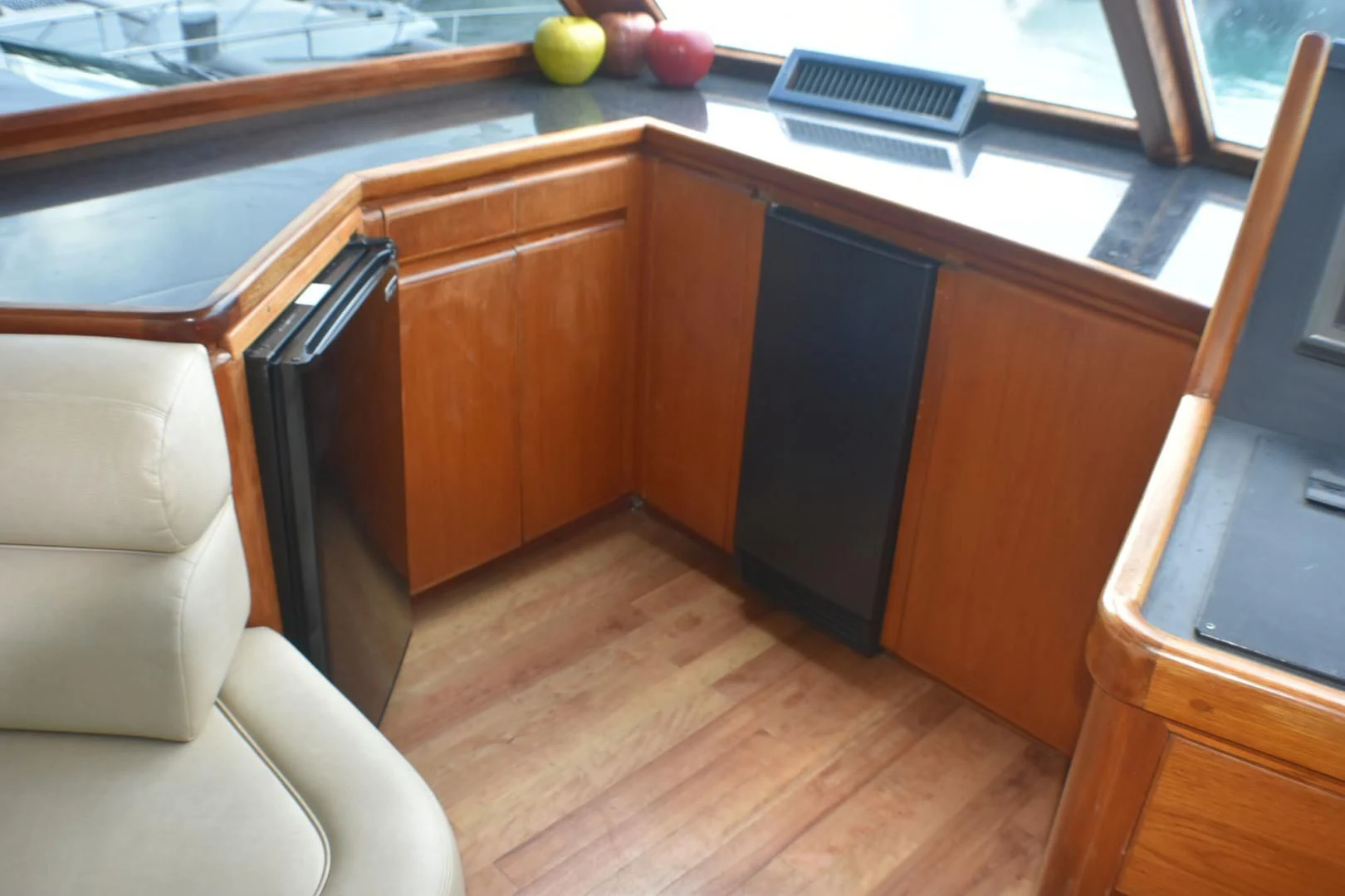 a kitchen with a wooden island aboard JEWEL OF THE NILE Yacht for Sale