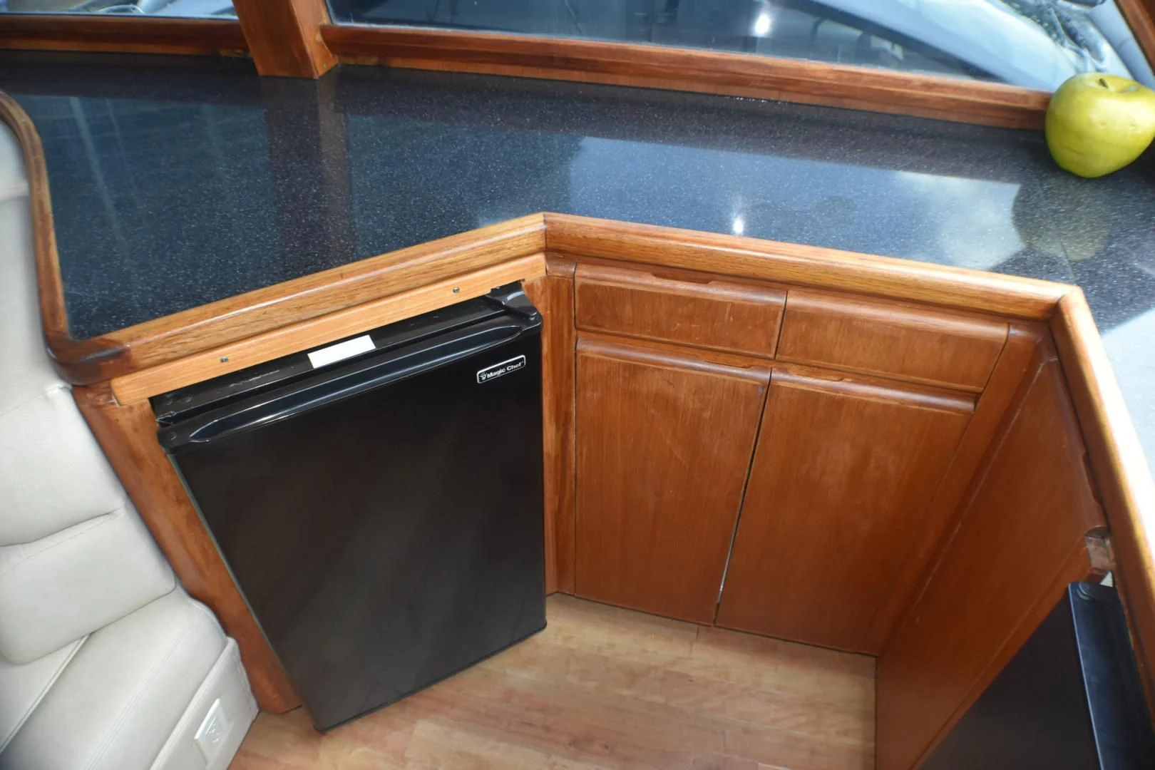 a kitchen with a black microwave aboard JEWEL OF THE NILE Yacht for Sale