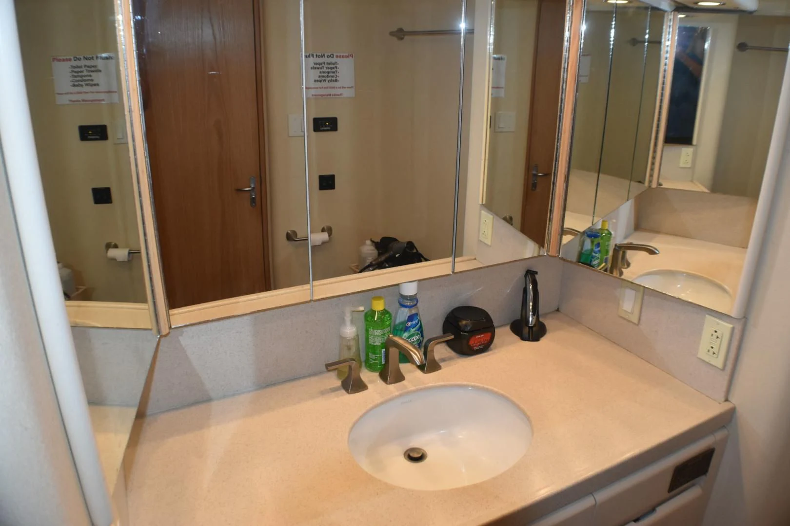 a bathroom with a large mirror aboard JEWEL OF THE NILE Yacht for Sale