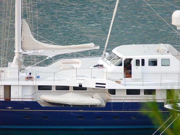 a white boat in the water aboard ENIGMA Yacht for Sale