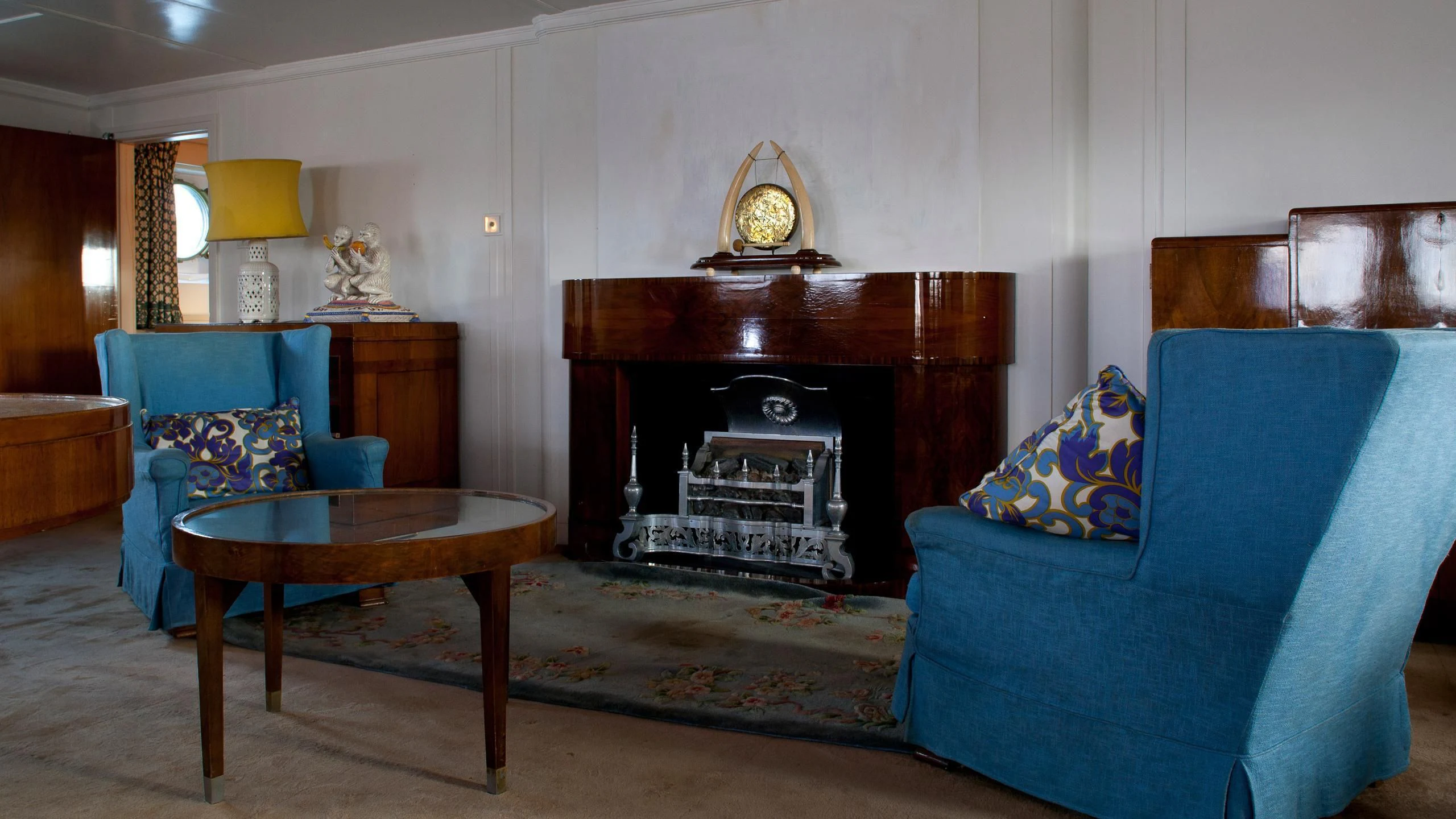 a living room with a fireplace aboard SHEMARA Yacht for Sale