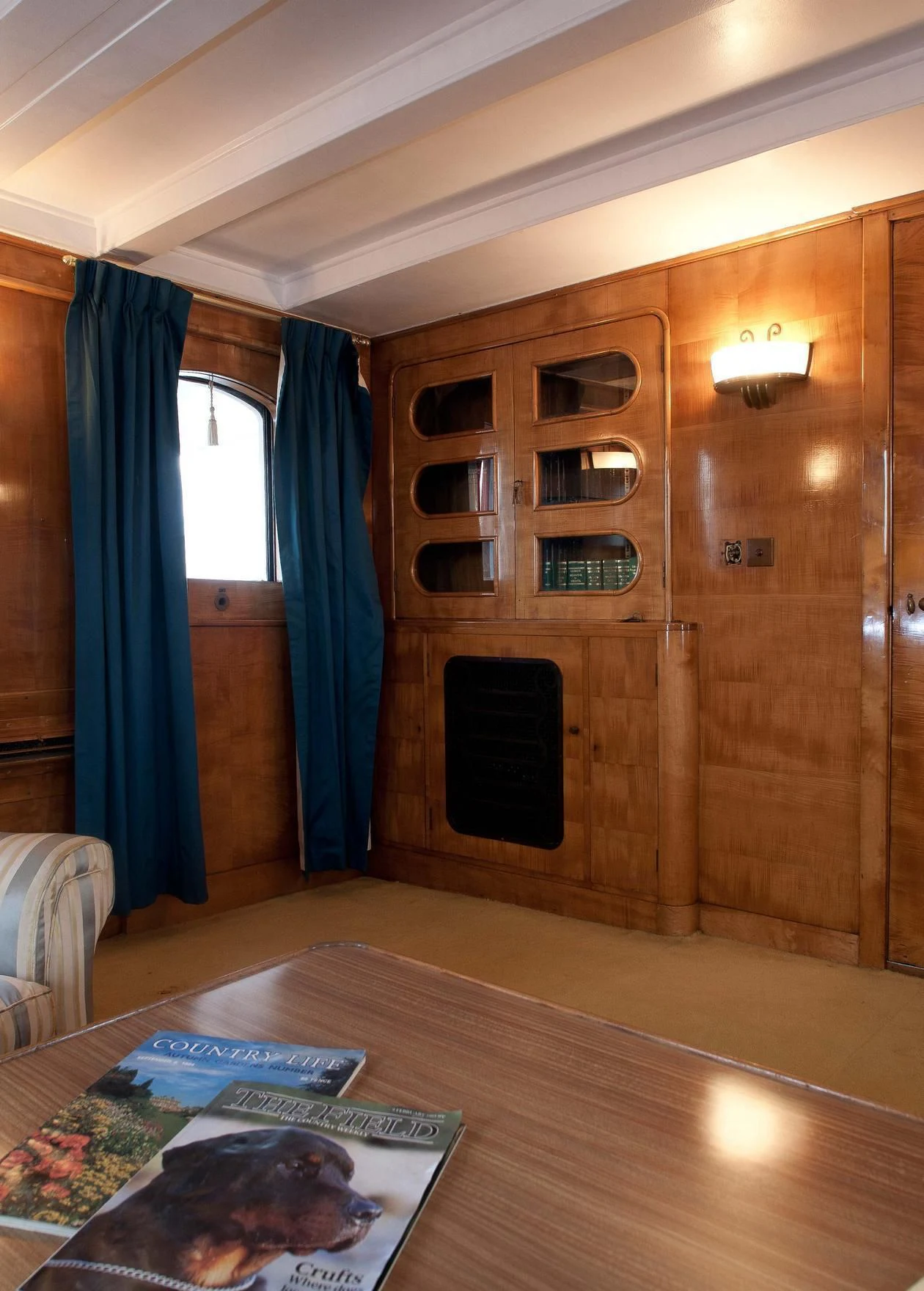 a room with a wood cabinet and a rug in it aboard SHEMARA Yacht for Sale