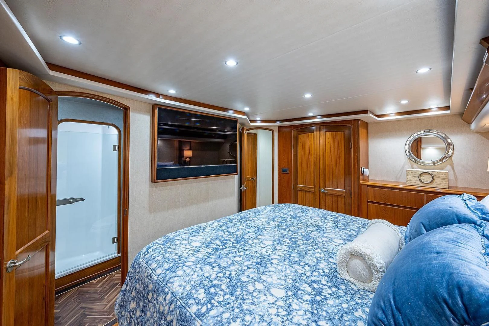 a bedroom with a bed and a television aboard LIFE IS GOOD Yacht for Sale