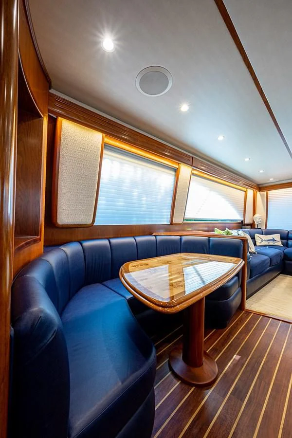 a living room with a couch and a coffee table aboard LIFE IS GOOD Yacht for Sale