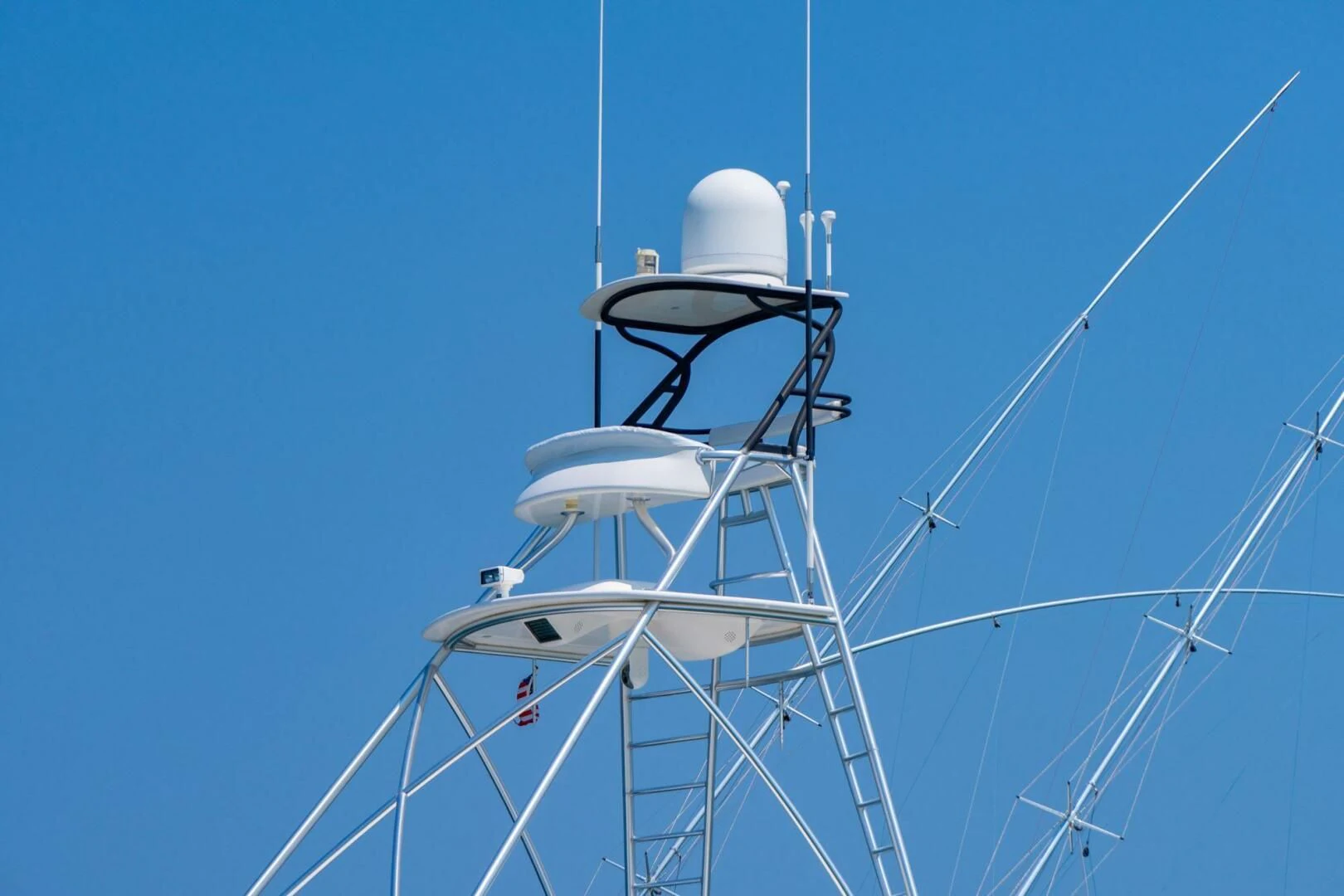a white tower with a satellite dish aboard LIFE IS GOOD Yacht for Sale