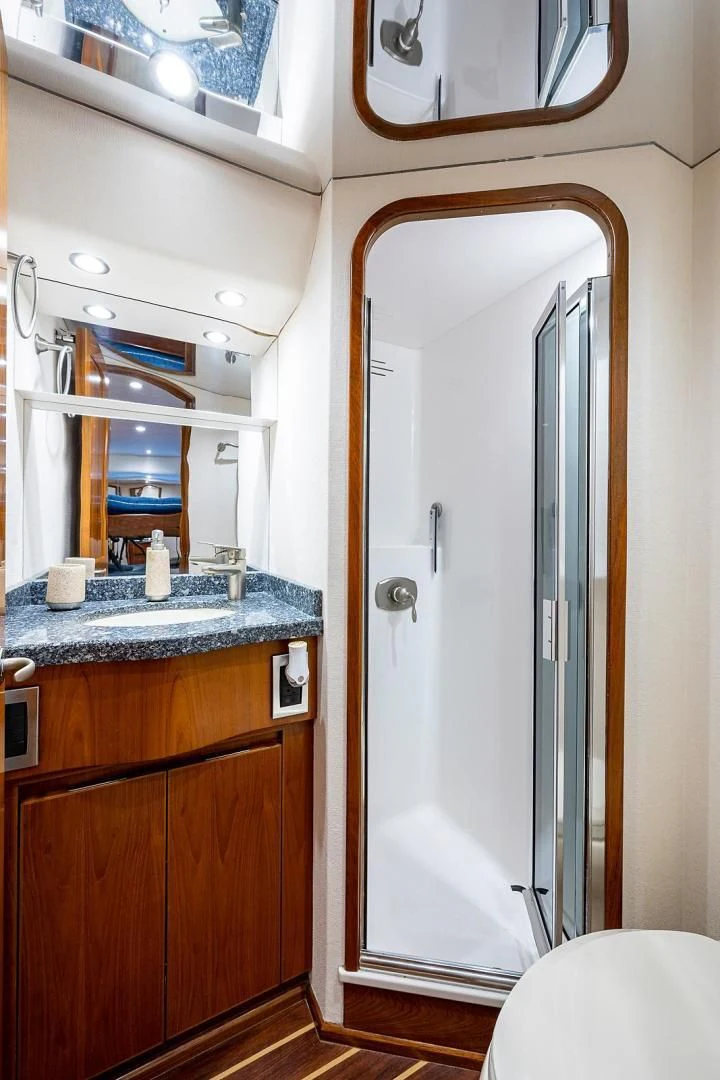 a bathroom with a large mirror aboard LIFE IS GOOD Yacht for Sale