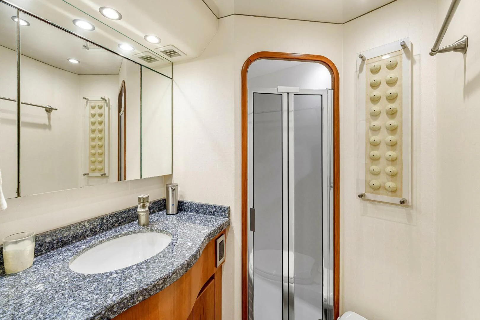 a bathroom with a sink and a shower unit aboard LIFE IS GOOD Yacht for Sale
