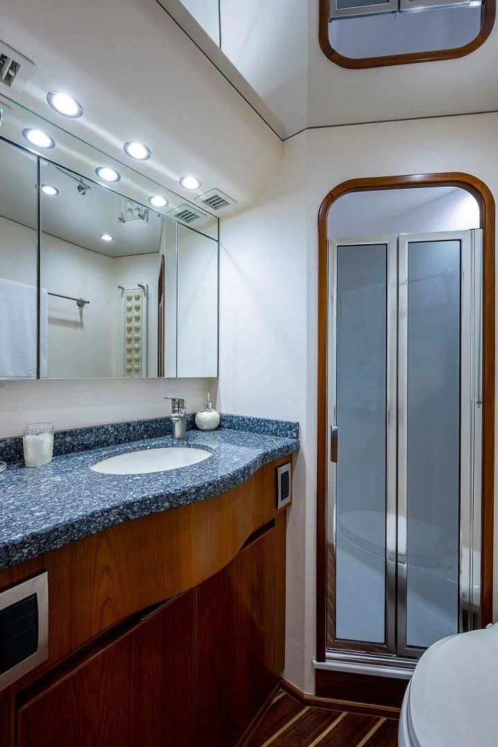 a bathroom with a sink and a shower aboard LIFE IS GOOD Yacht for Sale