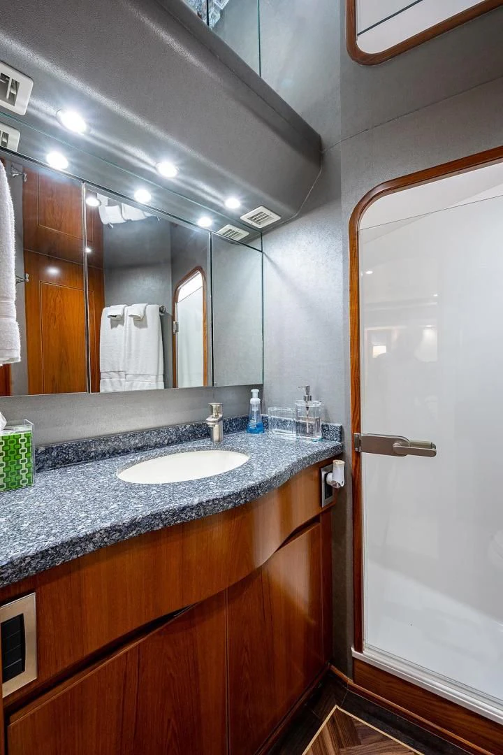 a bathroom with a sink and mirror aboard LIFE IS GOOD Yacht for Sale
