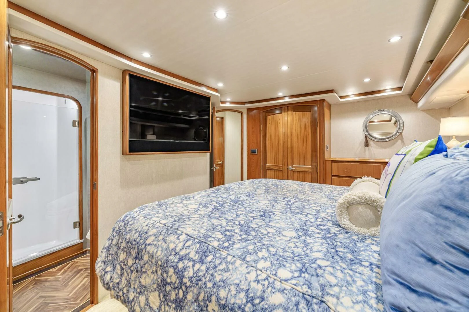 a bedroom with a bed and television aboard LIFE IS GOOD Yacht for Sale