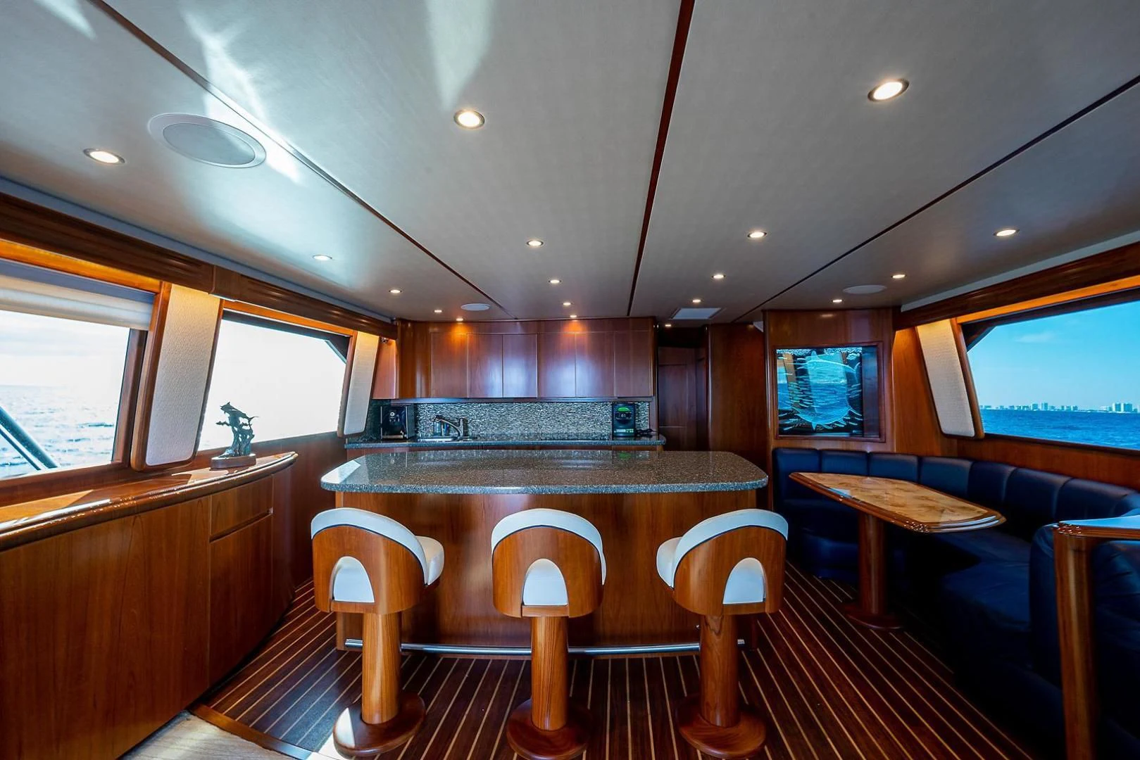 a large kitchen with wooden cabinets aboard LIFE IS GOOD Yacht for Sale