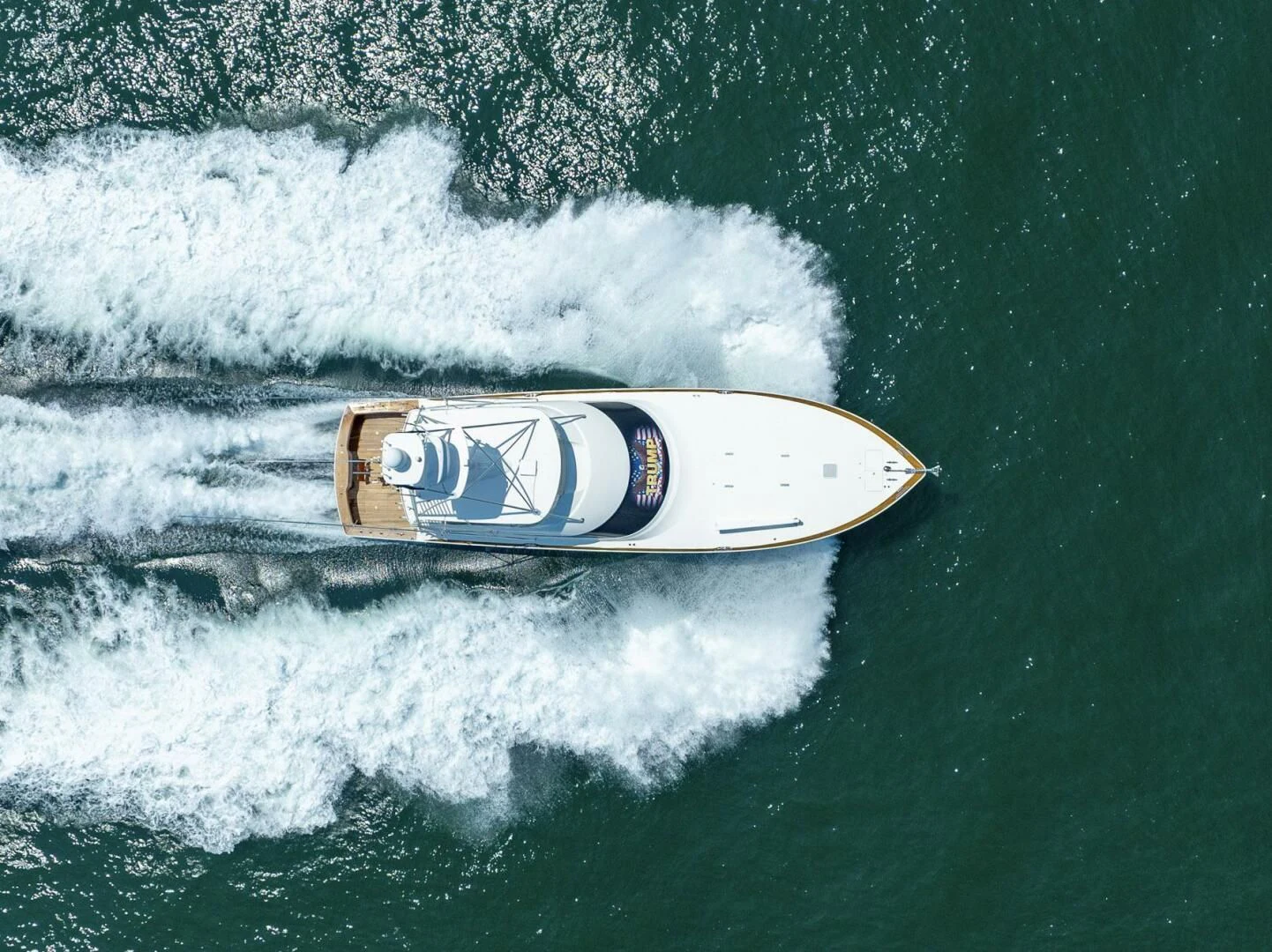a beer can on a surfboard in the ocean aboard LIFE IS GOOD Yacht for Sale