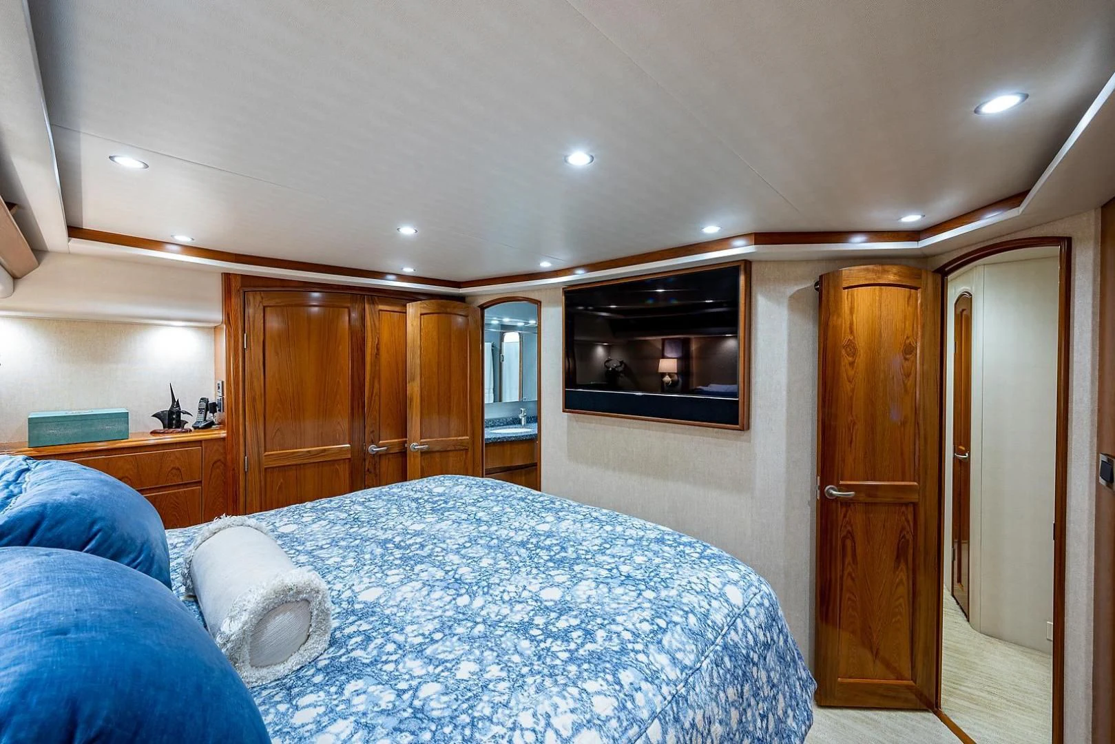 a bedroom with a bed and a television aboard LIFE IS GOOD Yacht for Sale
