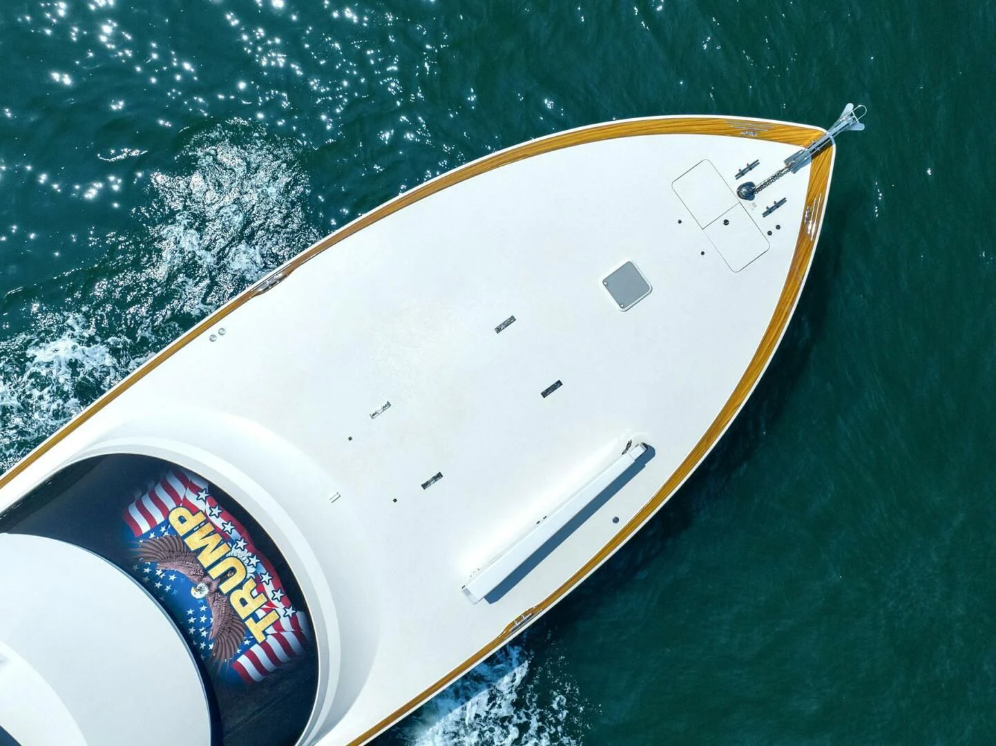 a white and yellow sports car aboard LIFE IS GOOD Yacht for Sale