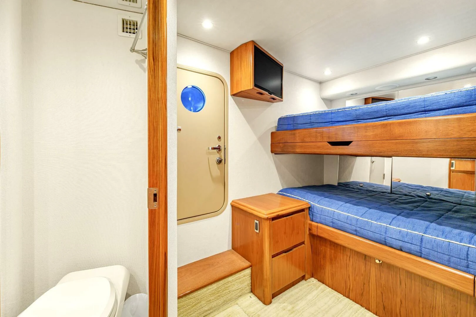 a room with a bed and a desk aboard LIFE IS GOOD Yacht for Sale
