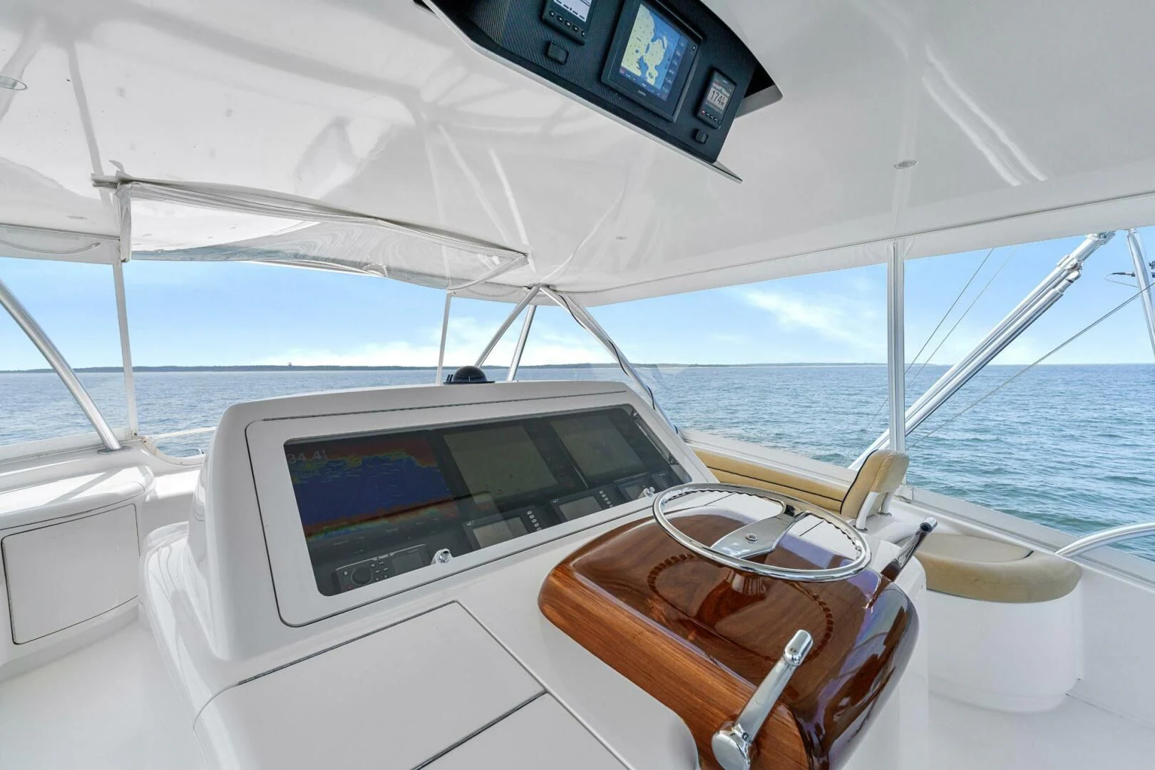 a boat with a seat and a laptop on it aboard LIFE IS GOOD Yacht for Sale