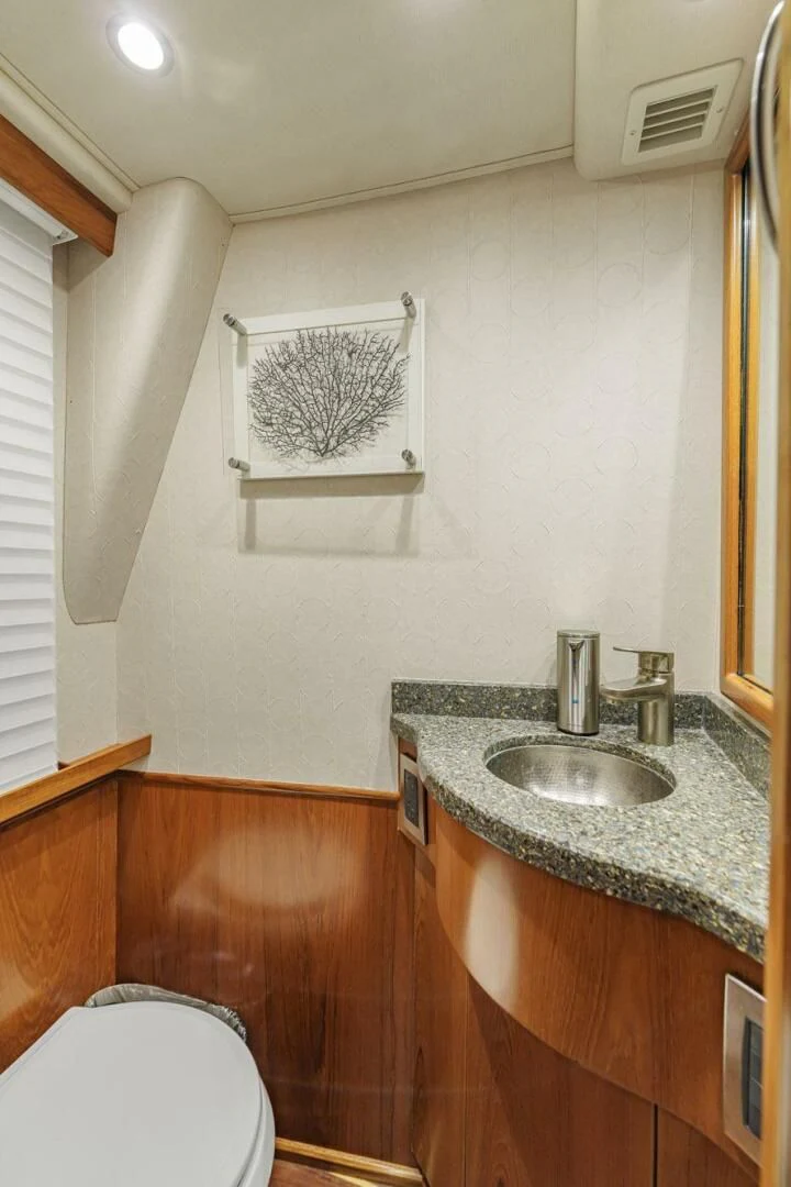 a bathroom with a sink and a toilet aboard LIFE IS GOOD Yacht for Sale