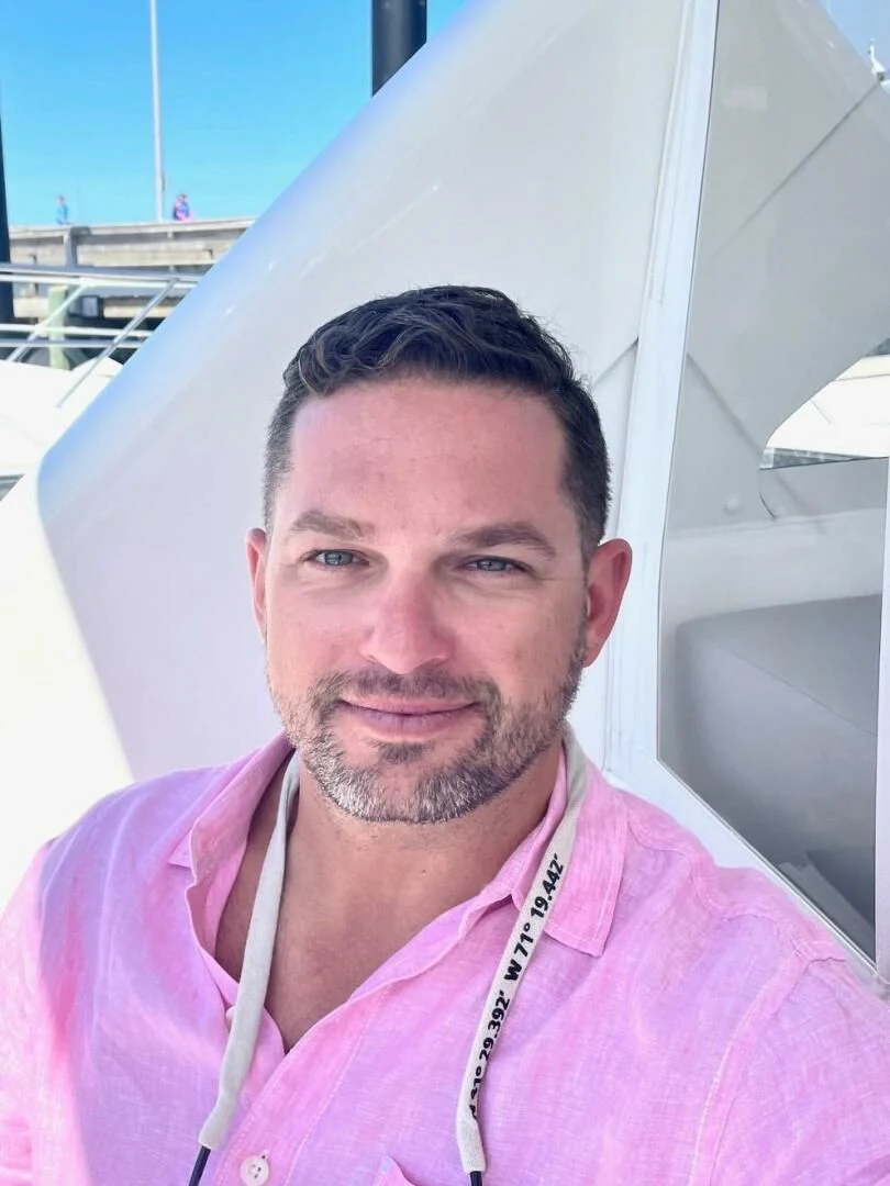 a man taking a selfie aboard LIFE IS GOOD Yacht for Sale