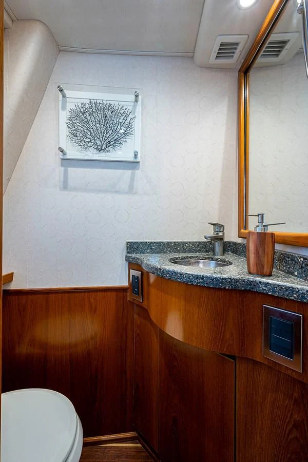 a bathroom with a sink and a mirror aboard LIFE IS GOOD Yacht for Sale