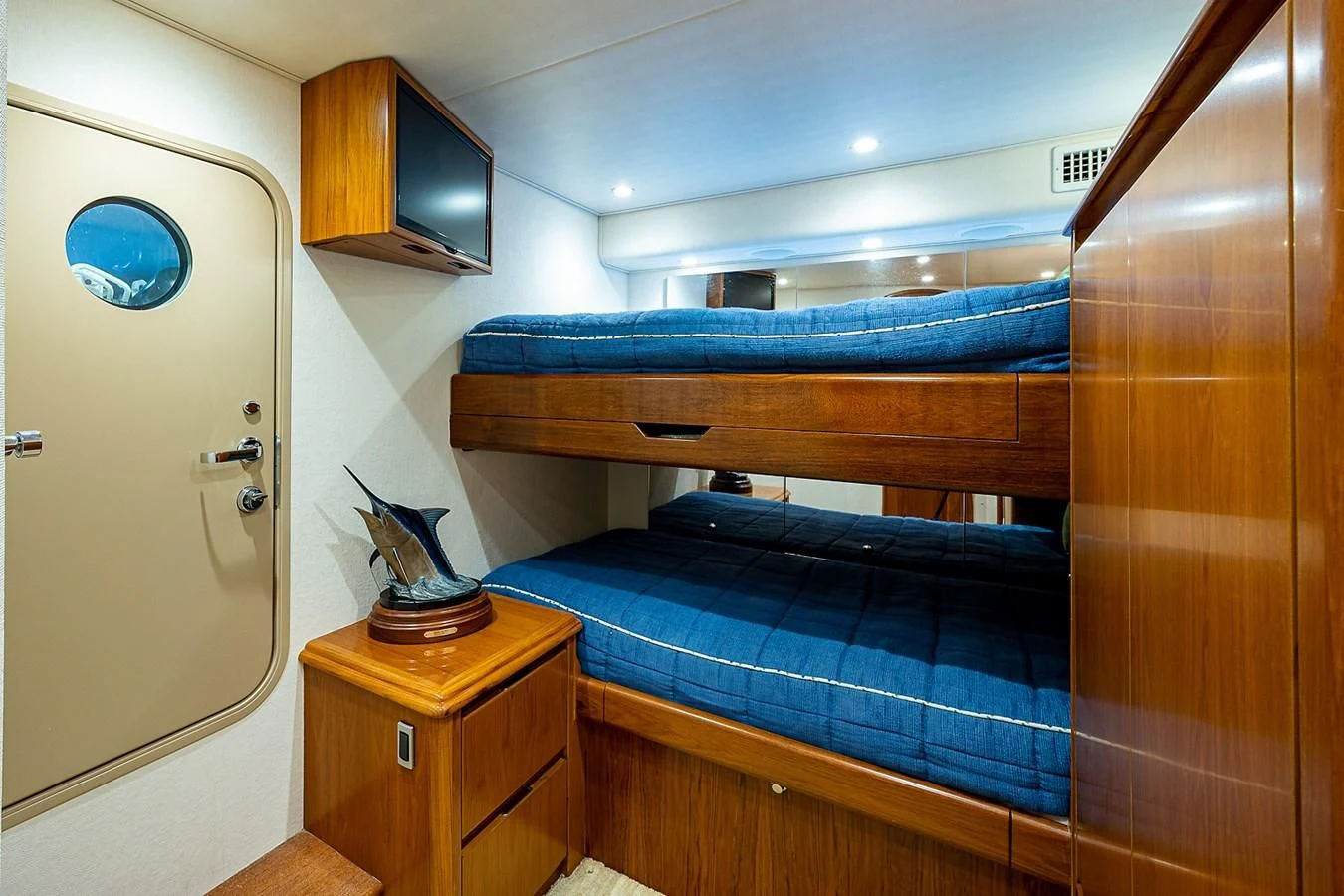 a bedroom with a bunk bed aboard LIFE IS GOOD Yacht for Sale