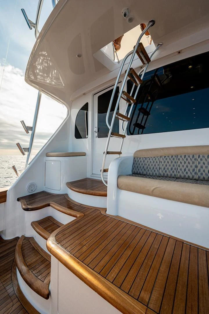 a boat with a white bed and a white sofa aboard LIFE IS GOOD Yacht for Sale