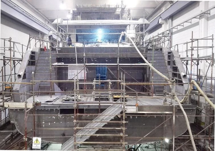 a large room with a staircase and a large metal object aboard RENATA Yacht for Sale