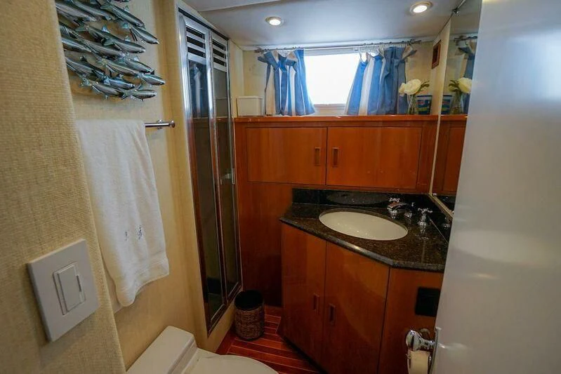 a bathroom with a sink and cabinets aboard MOMMA BEAR Yacht for Sale