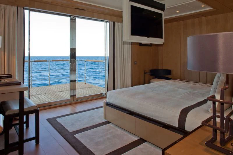 a room with a bed and a television aboard CHOPI CHOPI Yacht for Sale