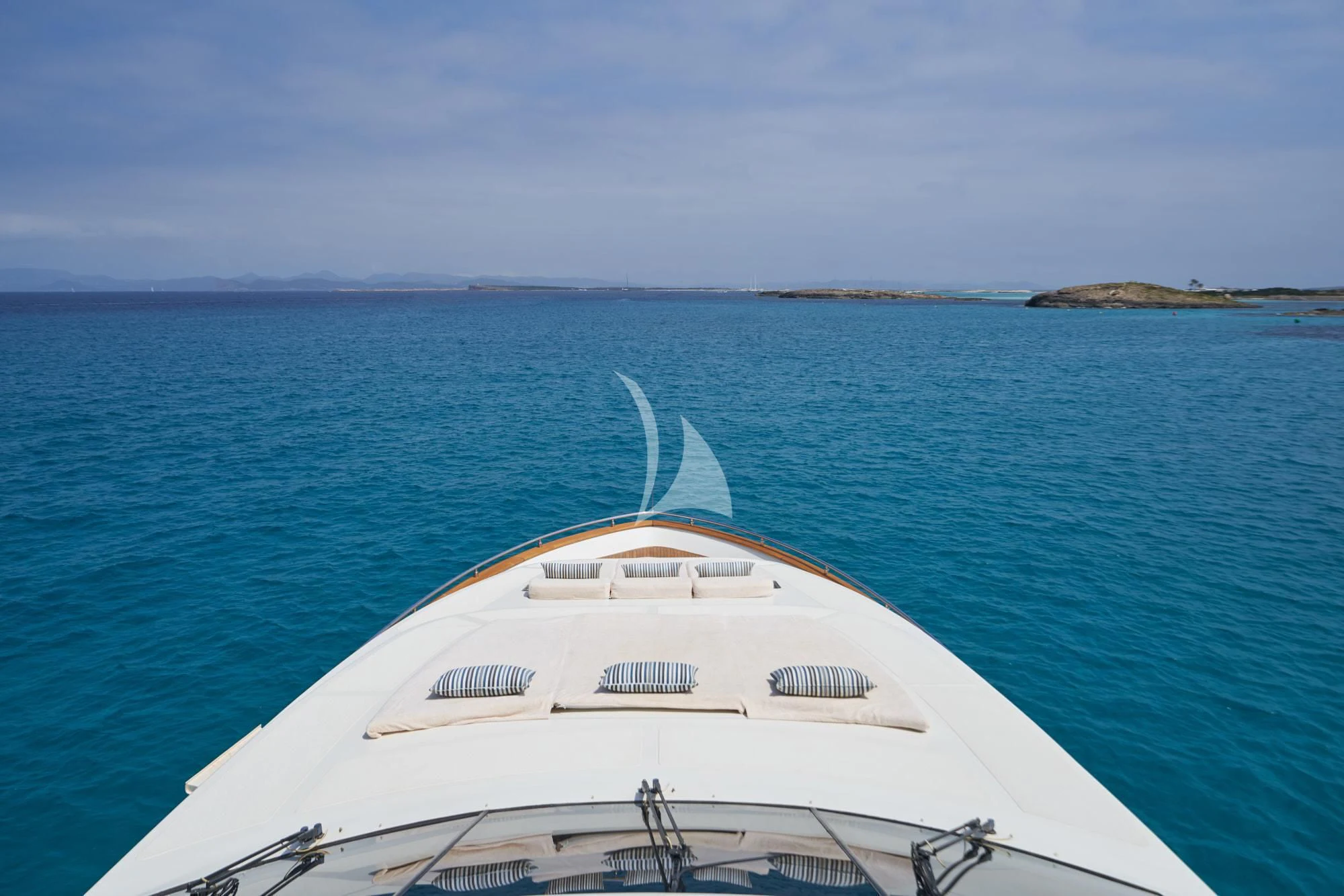 a white boat in the water aboard KIRIOS Yacht for Sale