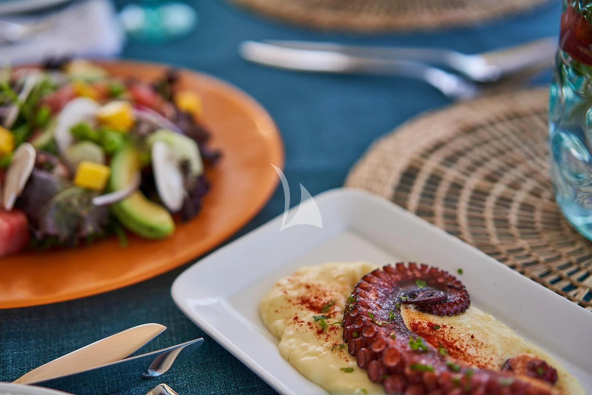 a plate of food aboard KIRIOS Yacht for Sale