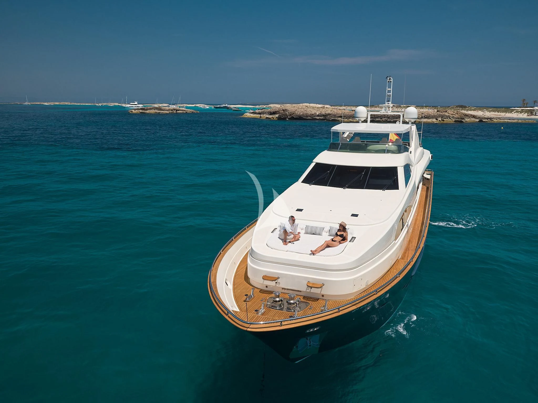 a man and a woman on a boat in the water aboard KIRIOS Yacht for Sale