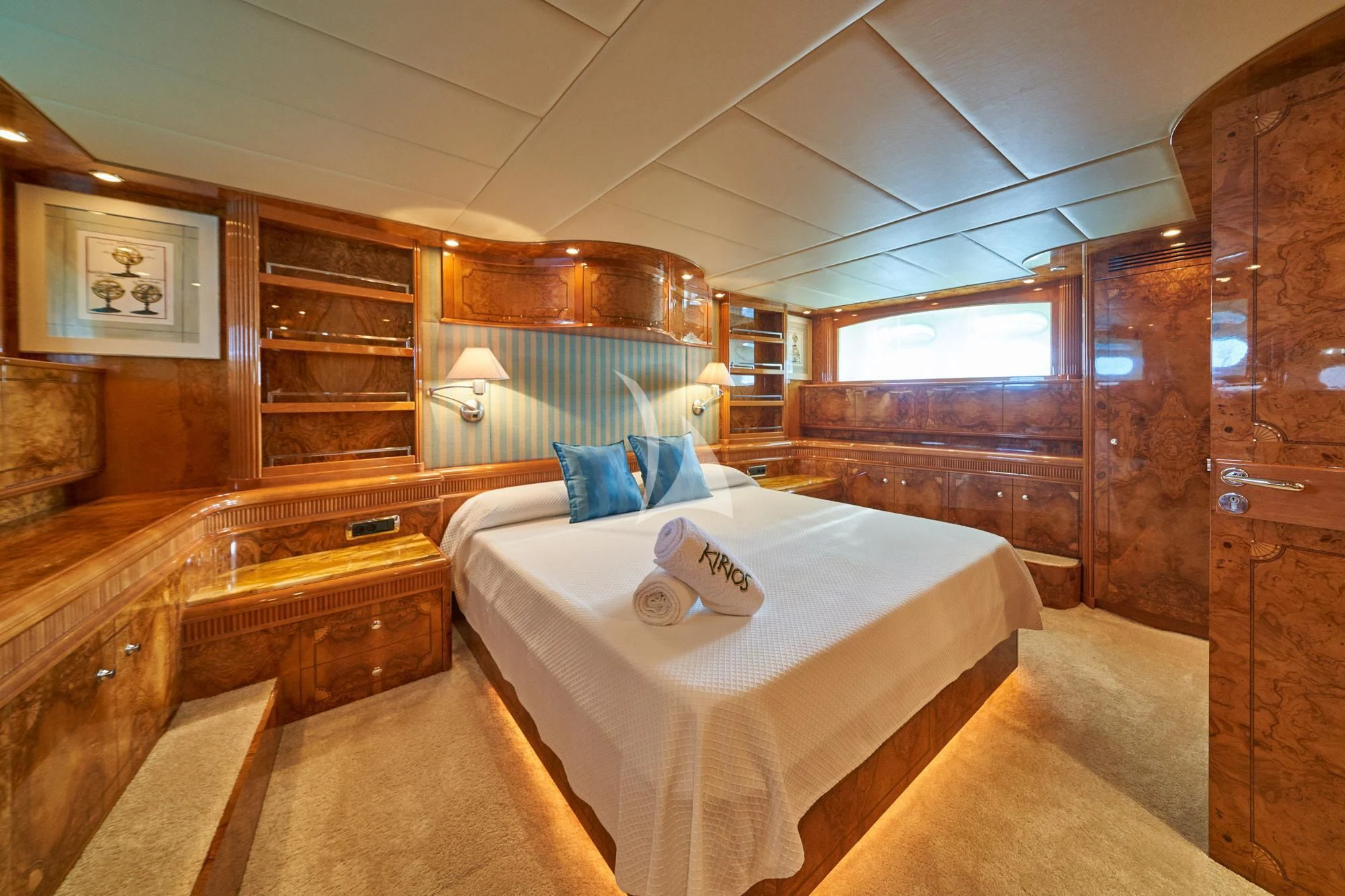 a bedroom with a bed and a dresser aboard KIRIOS Yacht for Sale