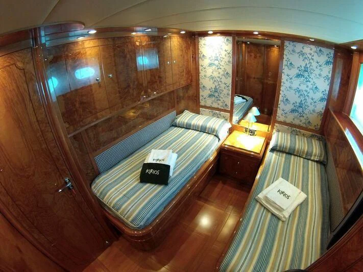 a bed in a room aboard KIRIOS Yacht for Sale