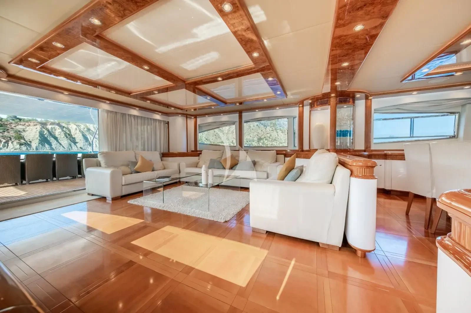 a large living room with a large ceiling aboard KIRIOS Yacht for Sale