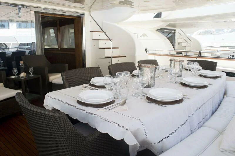 a table set for a dinner aboard KIRIOS Yacht for Sale