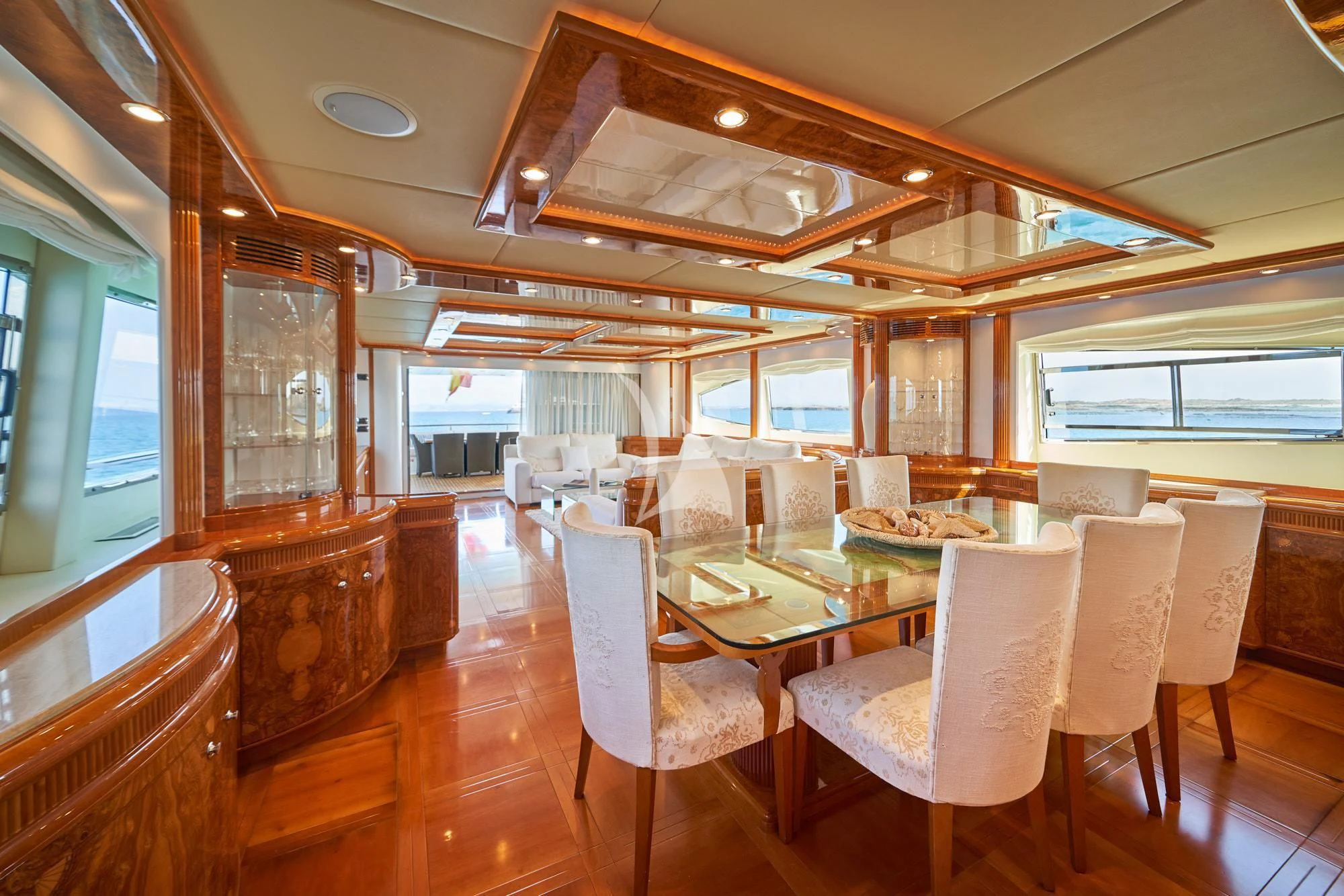 a dining room with a wood paneled ceiling aboard KIRIOS Yacht for Sale