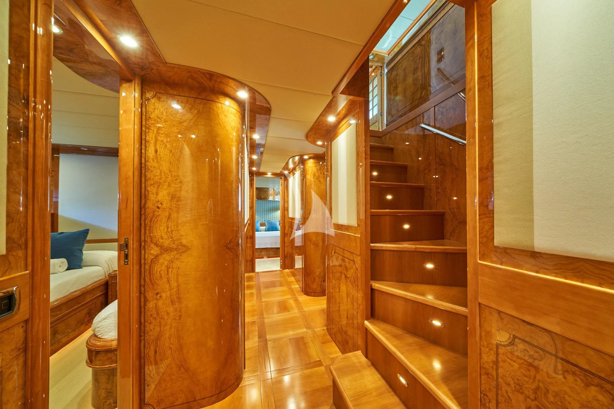 a room with a wood door and a wood cabinet aboard KIRIOS Yacht for Sale