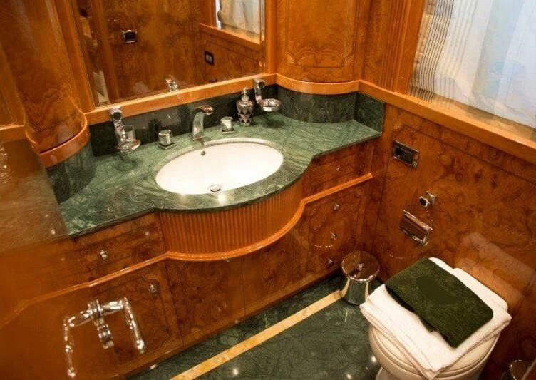 a bathroom with a sink and a mirror aboard KIRIOS Yacht for Sale