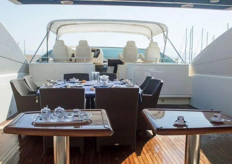 a restaurant with a table and chairs aboard KIRIOS Yacht for Sale