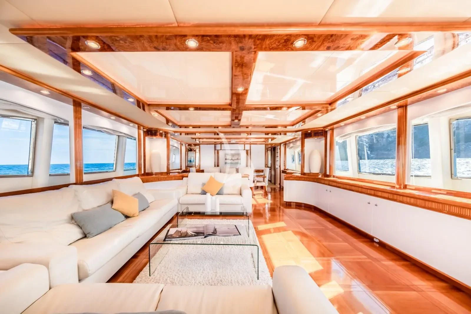 a room with a couch and a table aboard KIRIOS Yacht for Sale