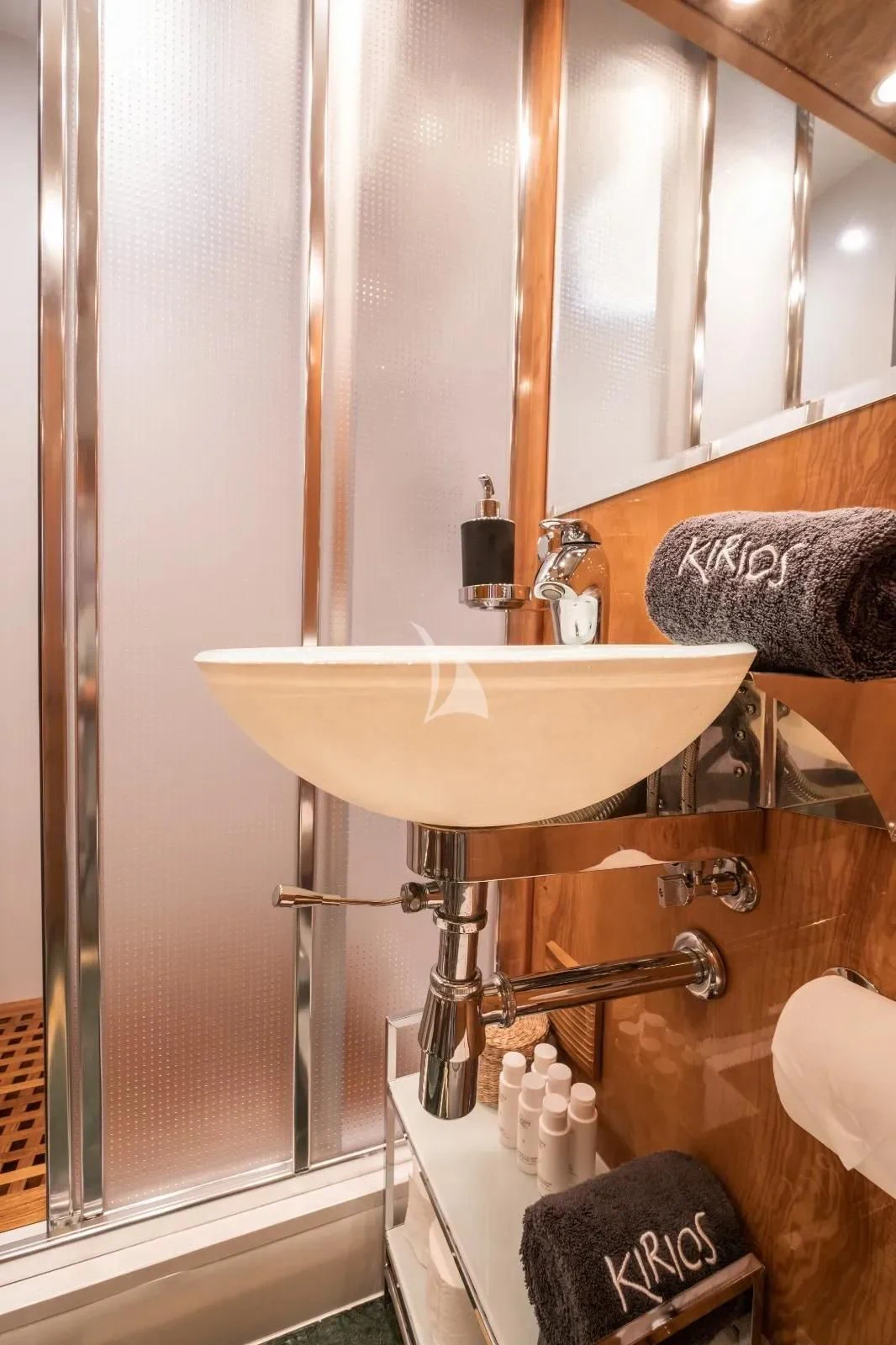 a bathroom sink with a mirror aboard KIRIOS Yacht for Sale