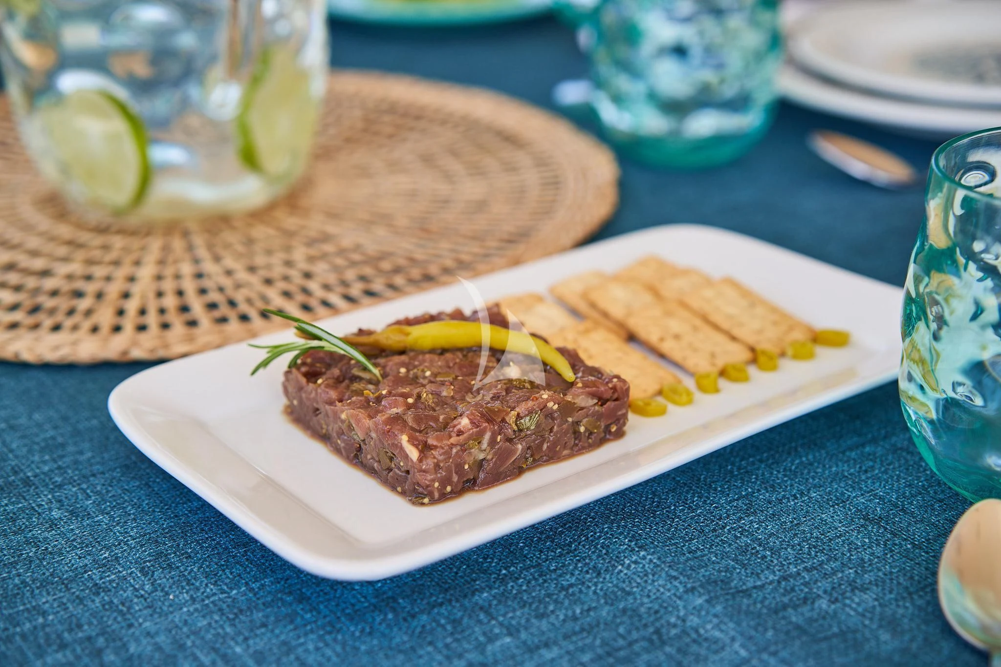 a plate of food aboard KIRIOS Yacht for Sale