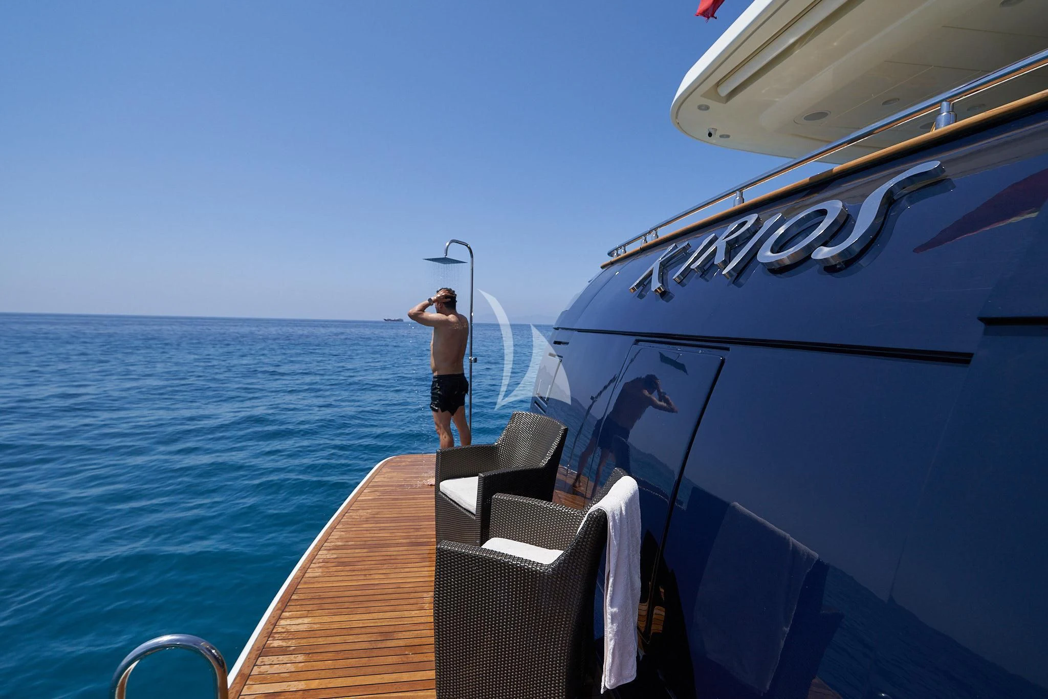 a person standing on a boat aboard KIRIOS Yacht for Sale