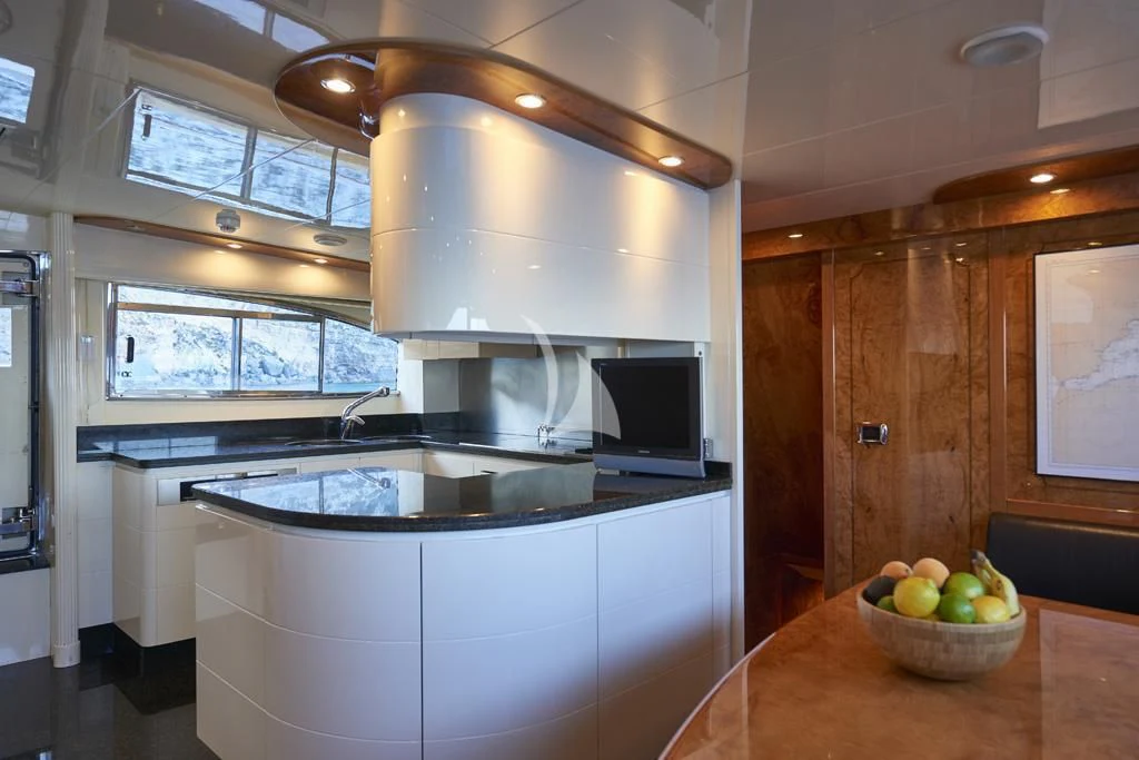a kitchen with a large island aboard KIRIOS Yacht for Sale