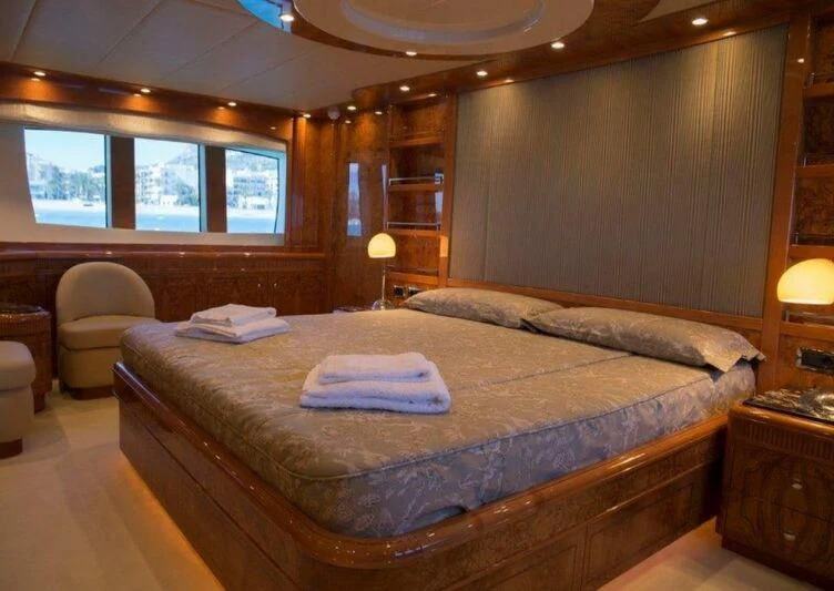 a bed in a room aboard KIRIOS Yacht for Sale