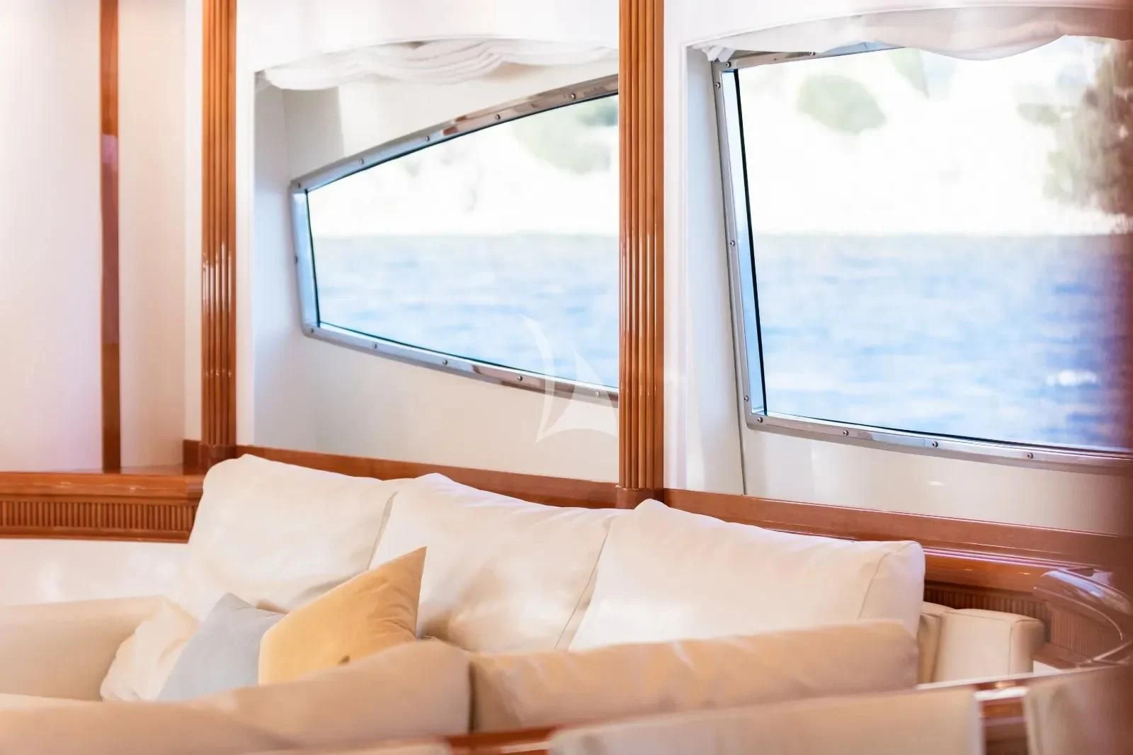 a bed with a window aboard KIRIOS Yacht for Sale
