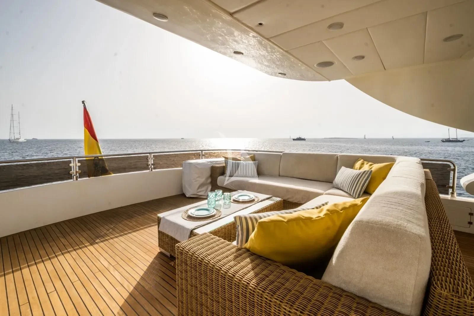 a room with a couch and a table on it aboard KIRIOS Yacht for Sale