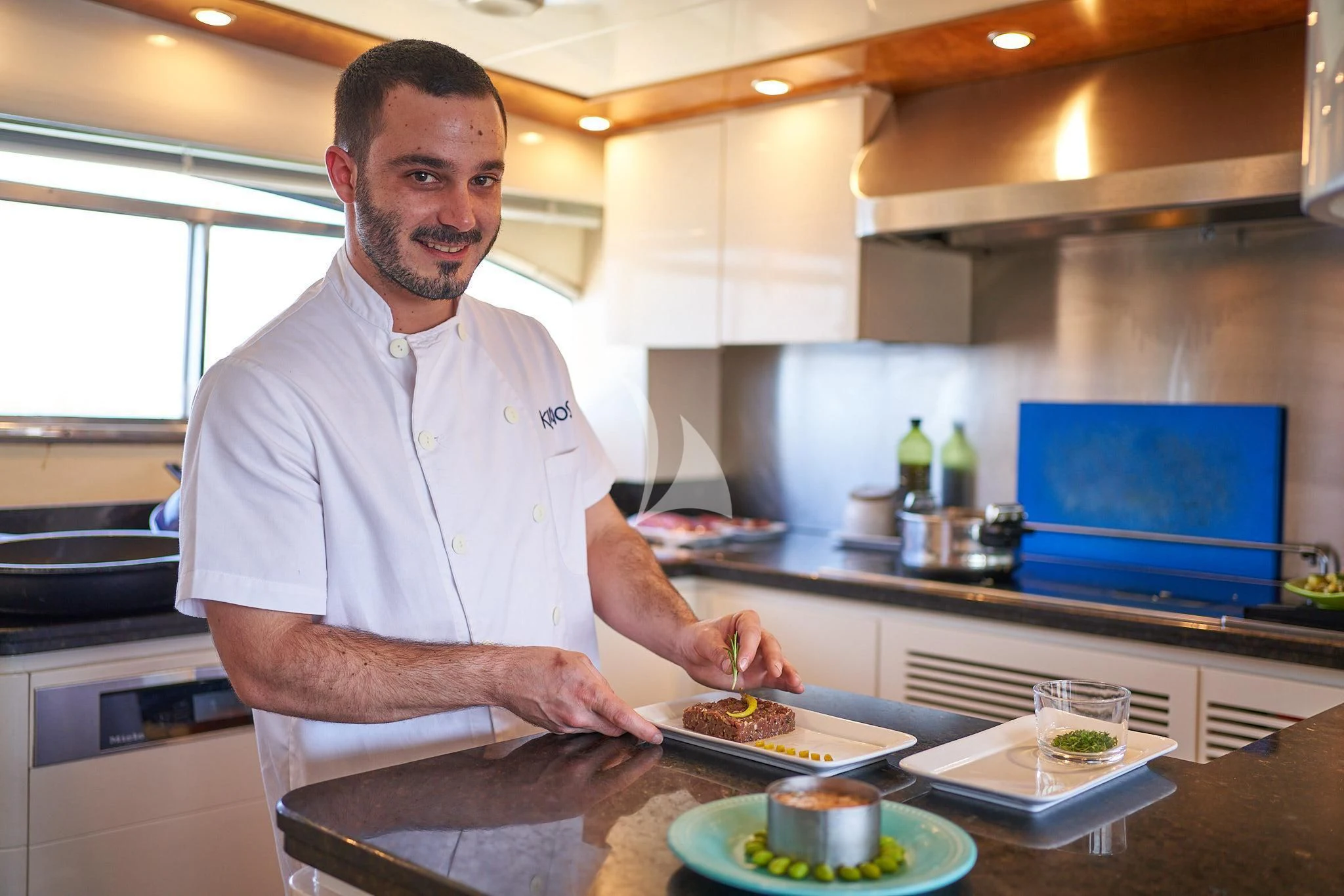 a man in a kitchen aboard KIRIOS Yacht for Sale