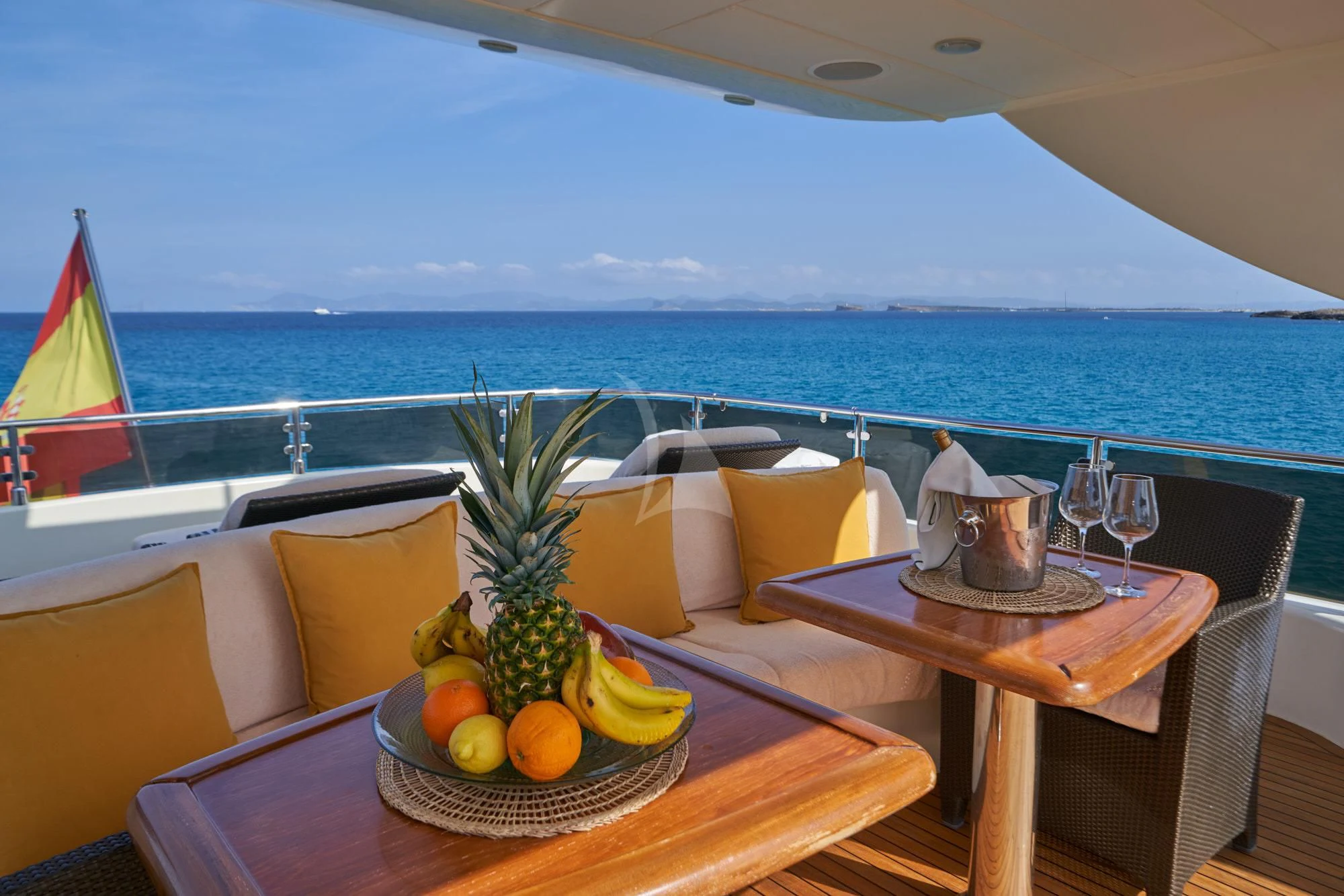 a table with a bowl of fruit on it aboard KIRIOS Yacht for Sale